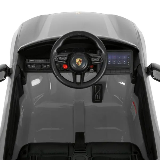 Салон и рулевое колесо детского Porsche Macan M 6314EBLR-11, вид сверху.